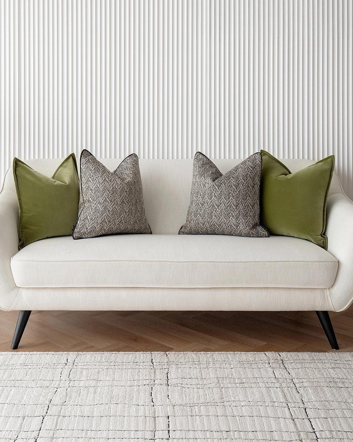 Maribel Bundle cushion in black, white and green, shown in a lifestyle front view as image 2