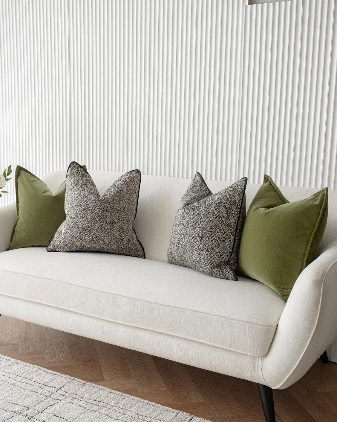 Maribel Bundle cushion in black, white and green, shown in a lifestyle right view as image 4