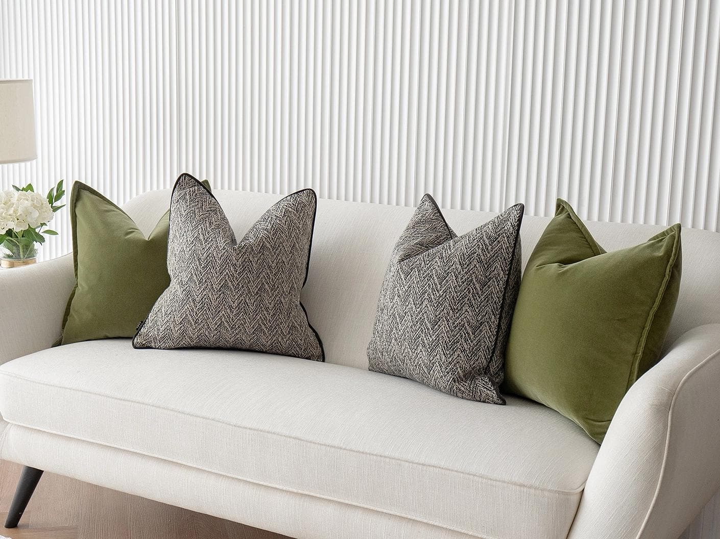 Maribel Bundle cushion in black, white and green, shown in a lifestyle right view as image 4