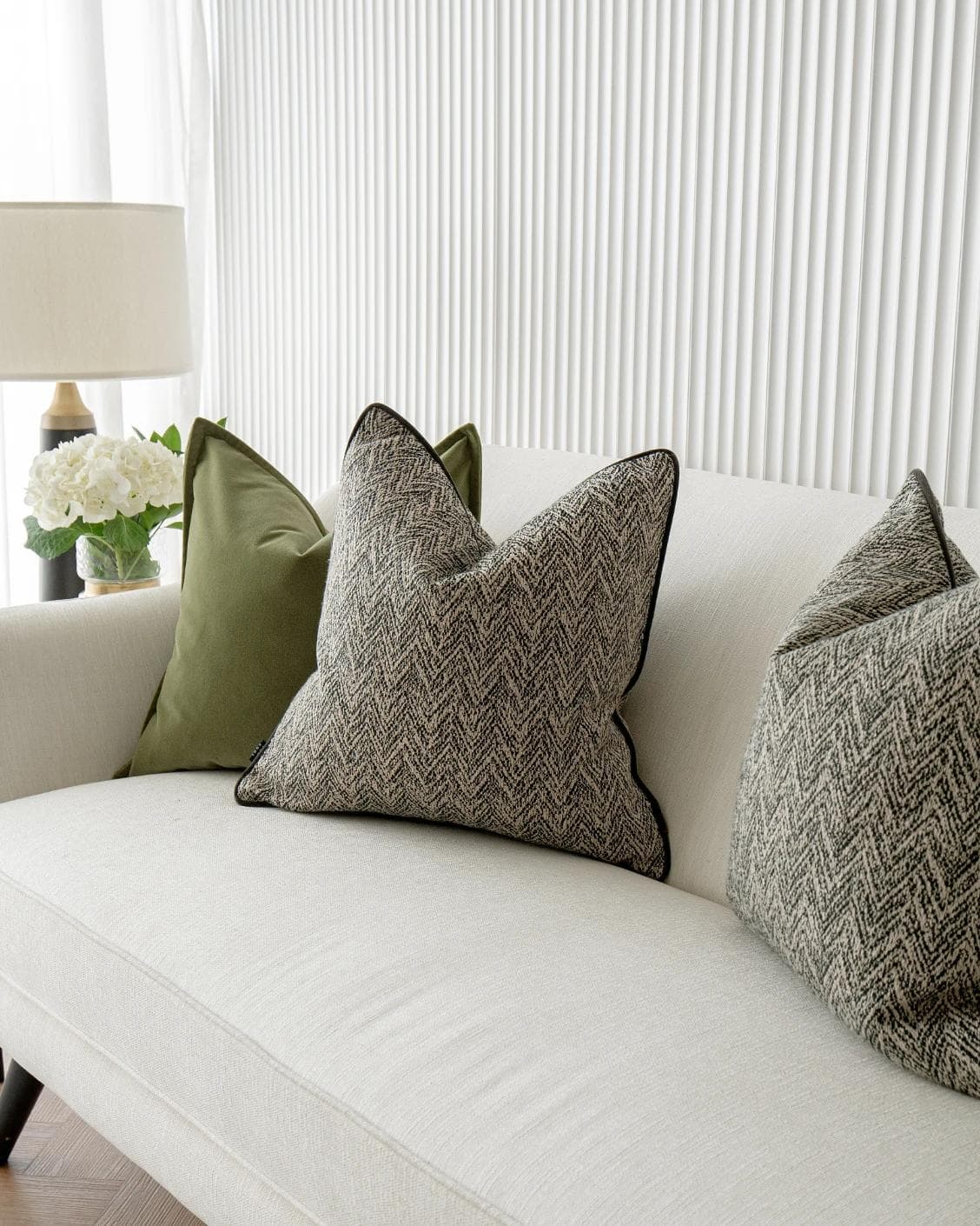 Maribel Bundle cushion in black, white and green, shown in a lifestyle right view as image 5