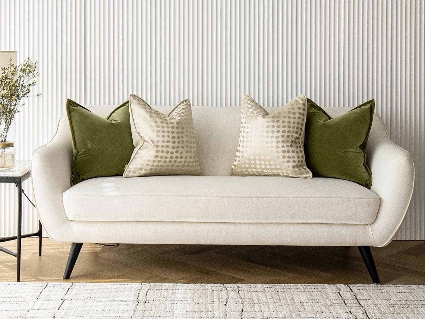 Orion Bundle cushion in green, beige and gold, shown in a lifestyle front view as image 4