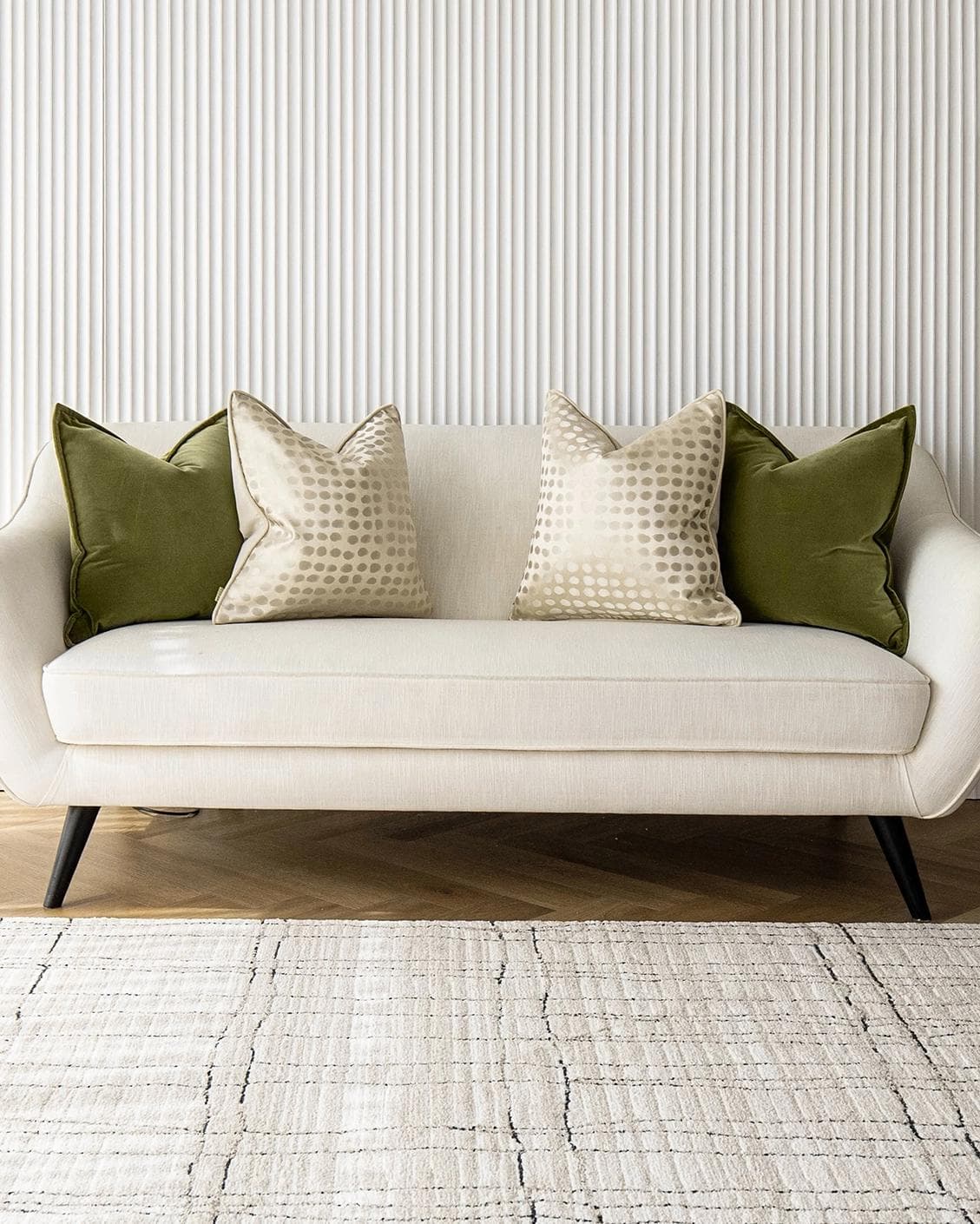 Orion Bundle cushion in green, beige and gold, shown in a lifestyle front view as image 4