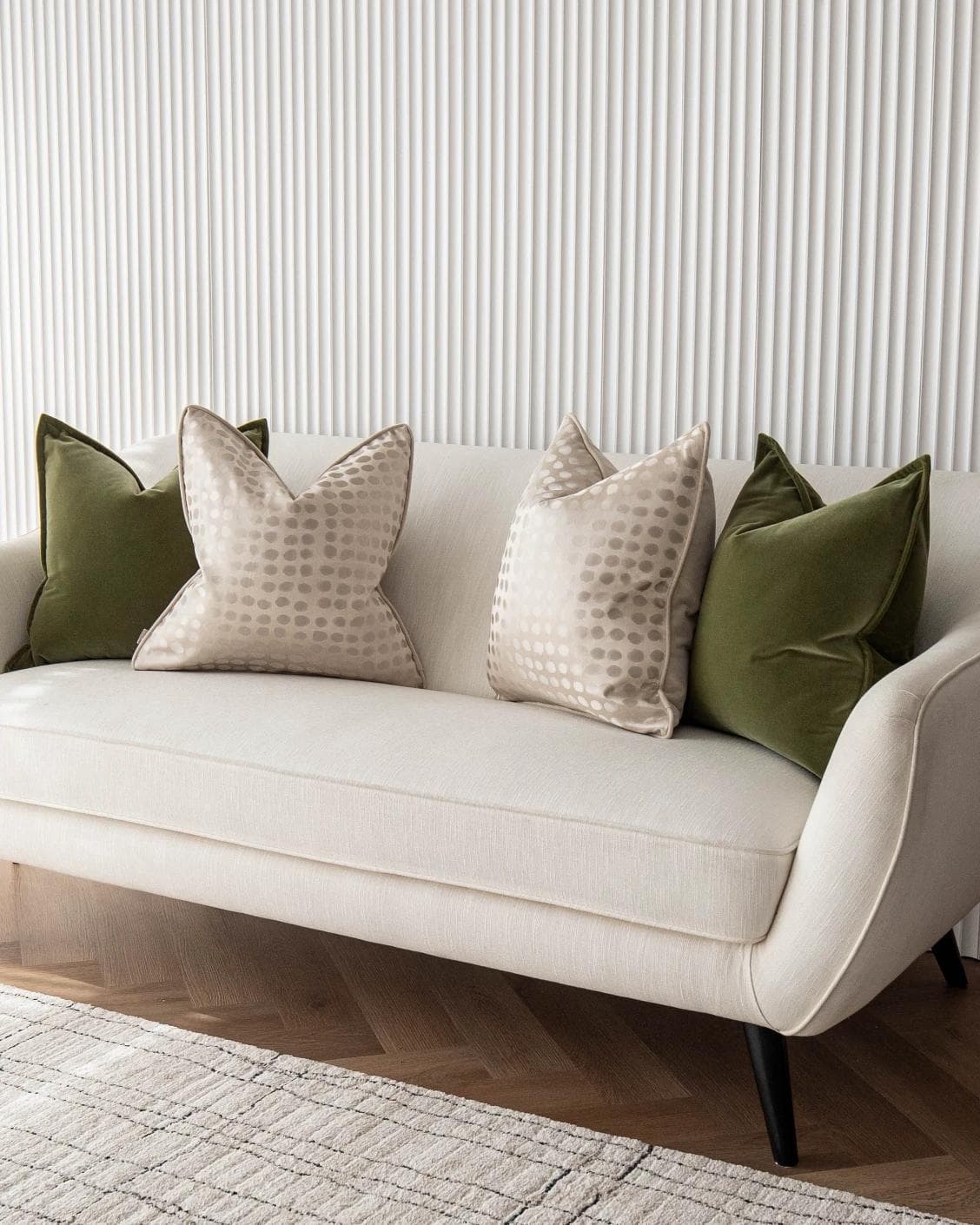 Orion Bundle cushion in green, beige and gold, shown in a lifestyle right view as image 2
