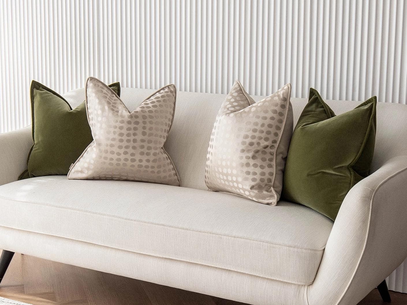 Orion Bundle cushion in green, beige and gold, shown in a lifestyle right view as image 2