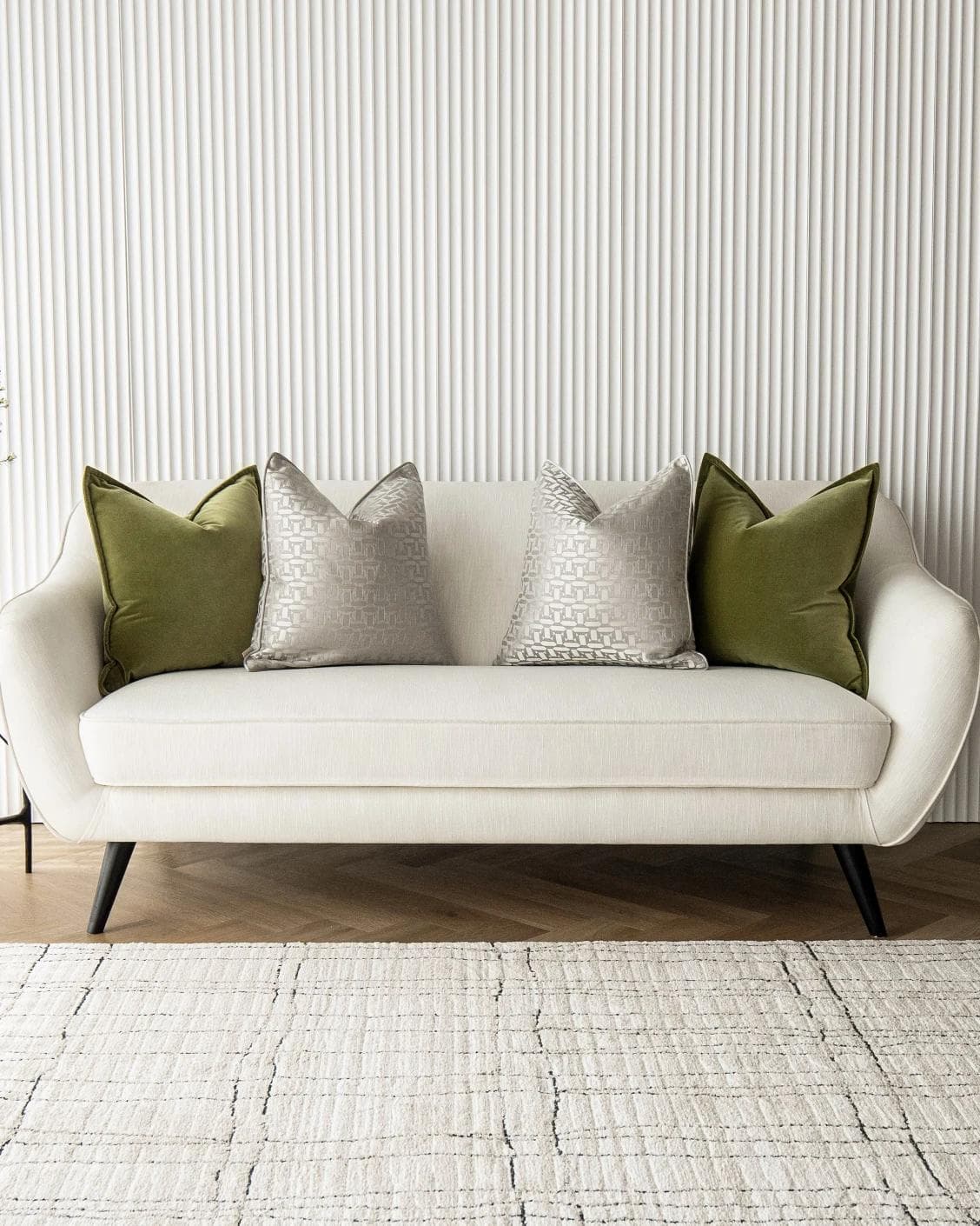 Oriana Bundle cushion in green, beige and silver, shown in a lifestyle front view as image 4
