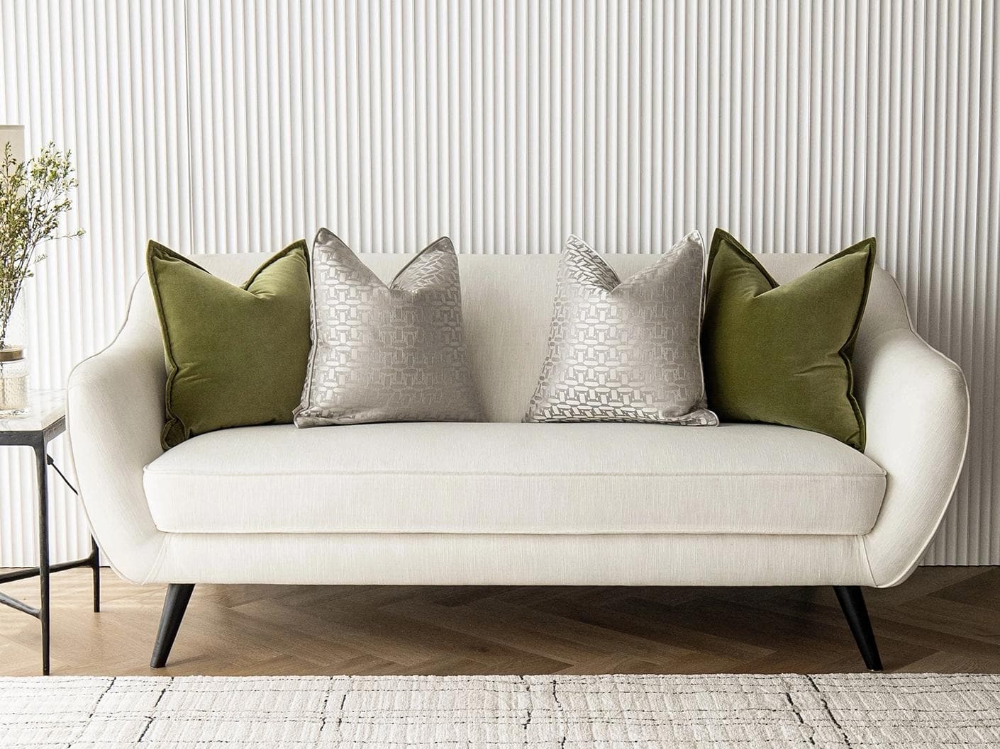 Oriana Bundle cushion in green, beige and silver, shown in a lifestyle front view as image 4