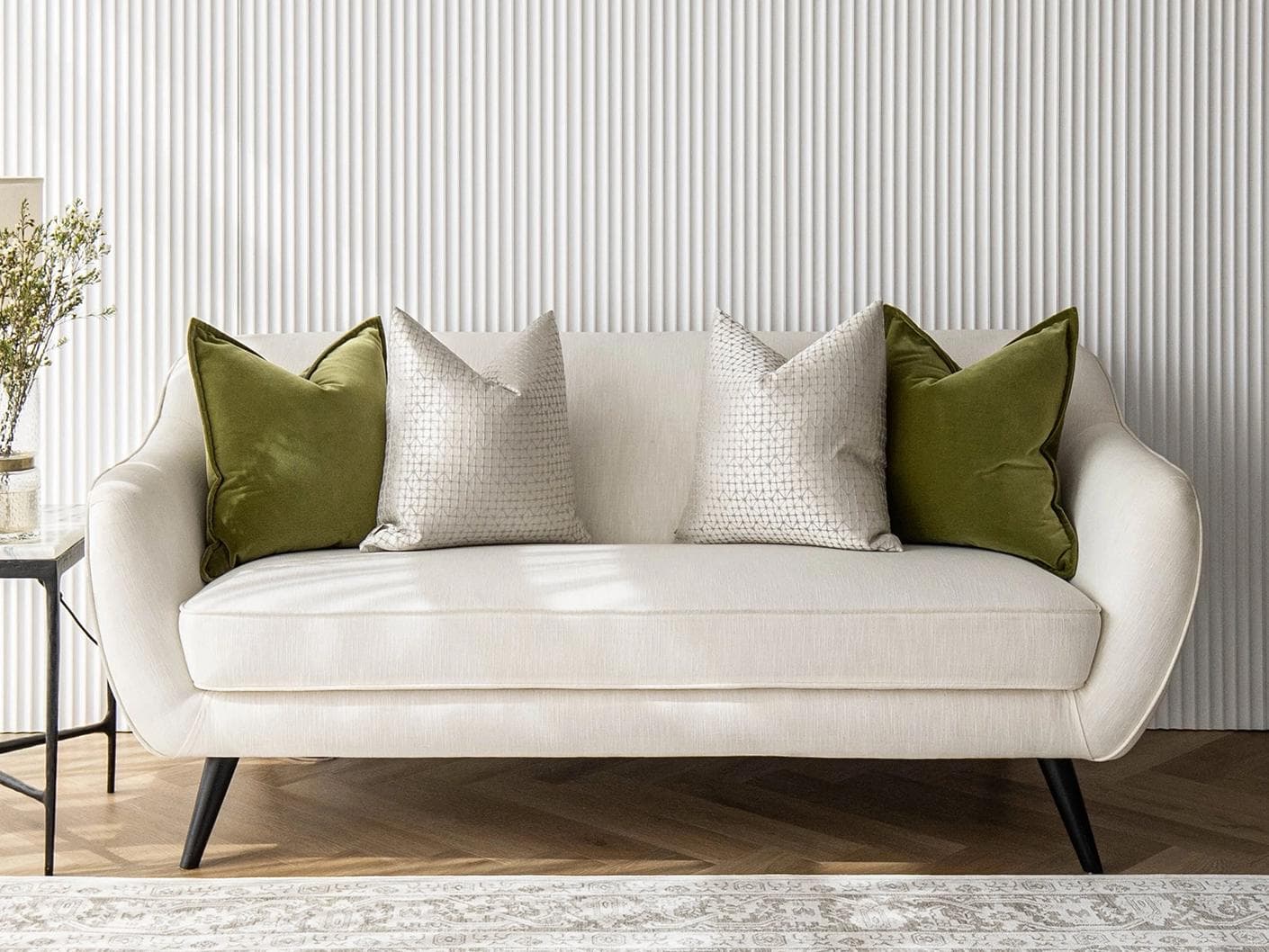 Otto Bundle cushion in silver, green and white, shown in a lifestyle front view as image 4