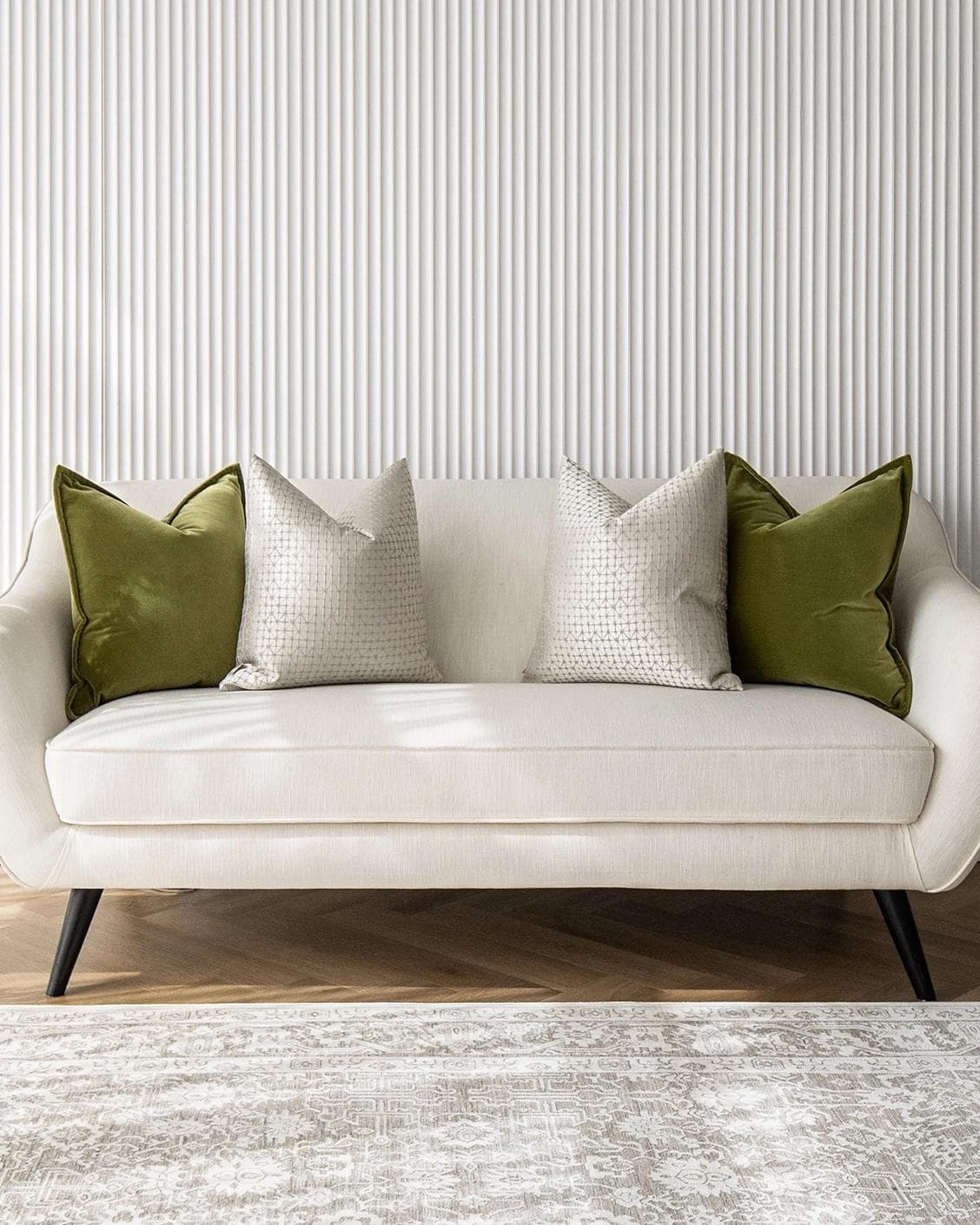 Otto Bundle cushion in silver, green and white, shown in a lifestyle front view as image 4