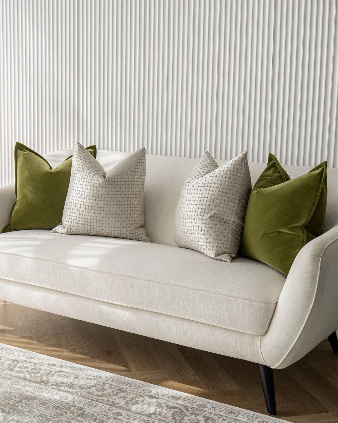 Otto Bundle cushion in silver, green and white, shown in a lifestyle right view as image 2