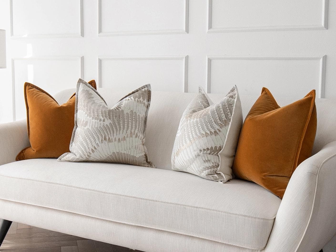 Emilia Bundle cushion in orange, brown and grey, shown in a lifestyle right view as image 2