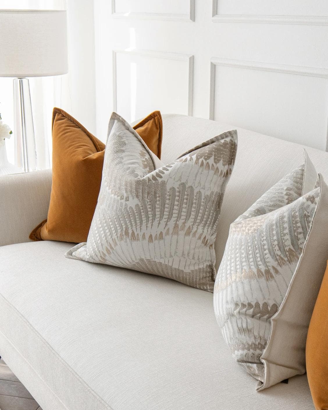 Emilia Bundle cushion in orange, brown and grey, shown in a lifestyle right view as image 5