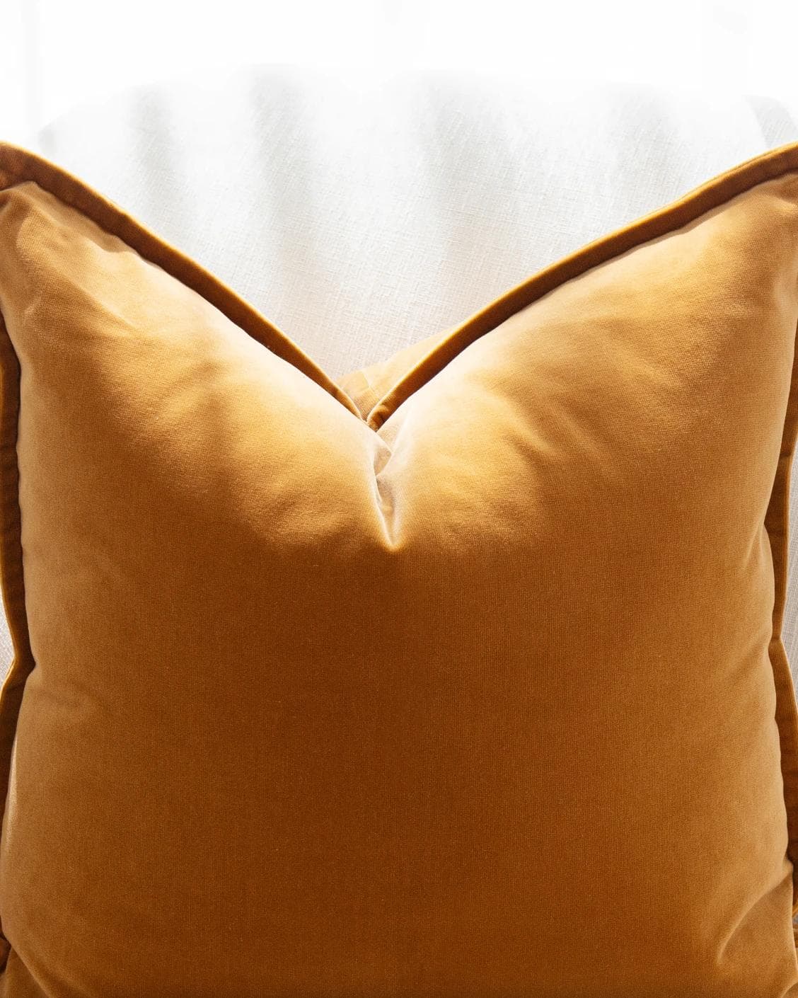 Emilia Bundle cushion in orange, brown and grey, shown in a product front view as image 6
