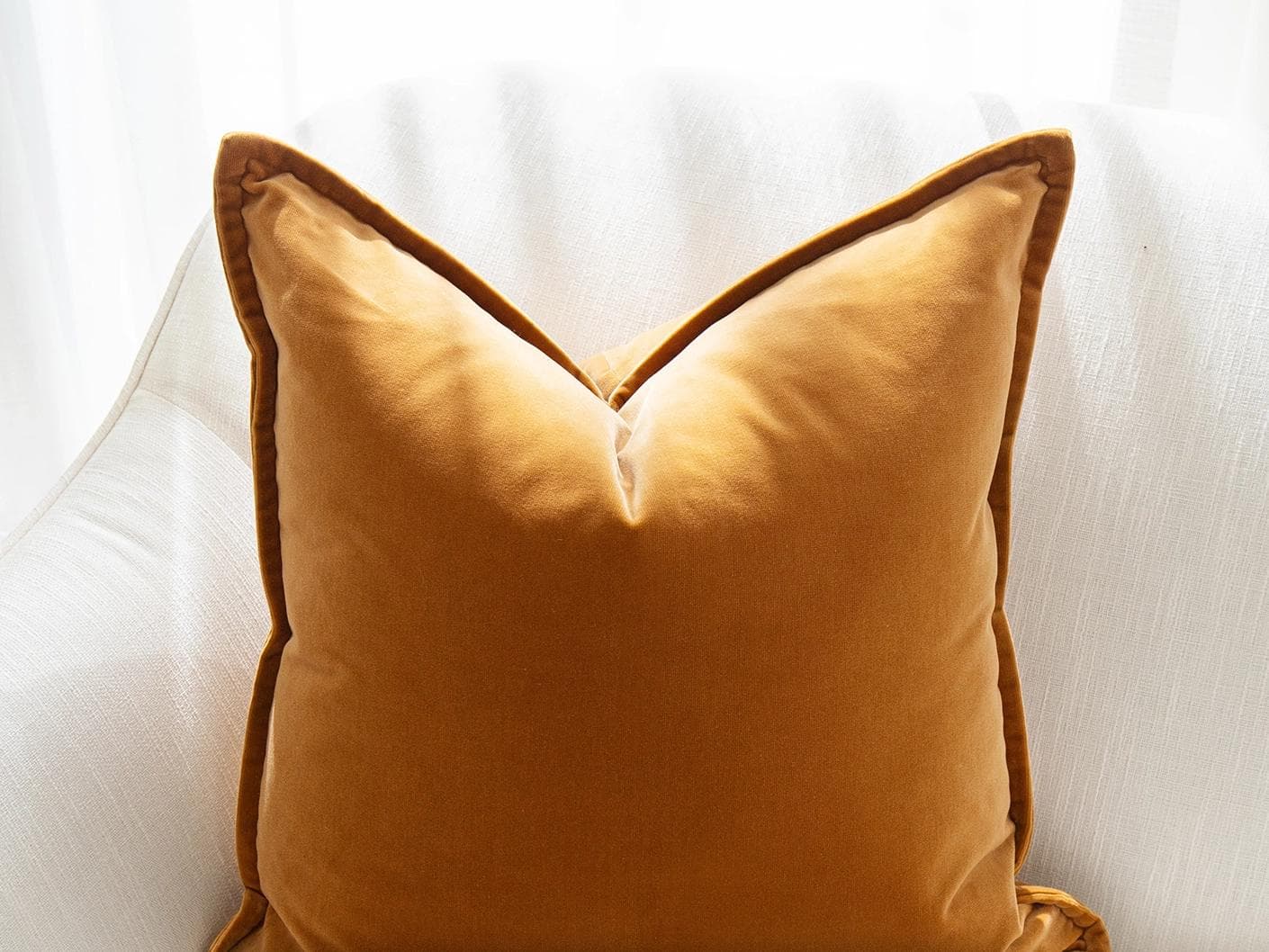 Emilia Bundle cushion in orange, brown and grey, shown in a product front view as image 6