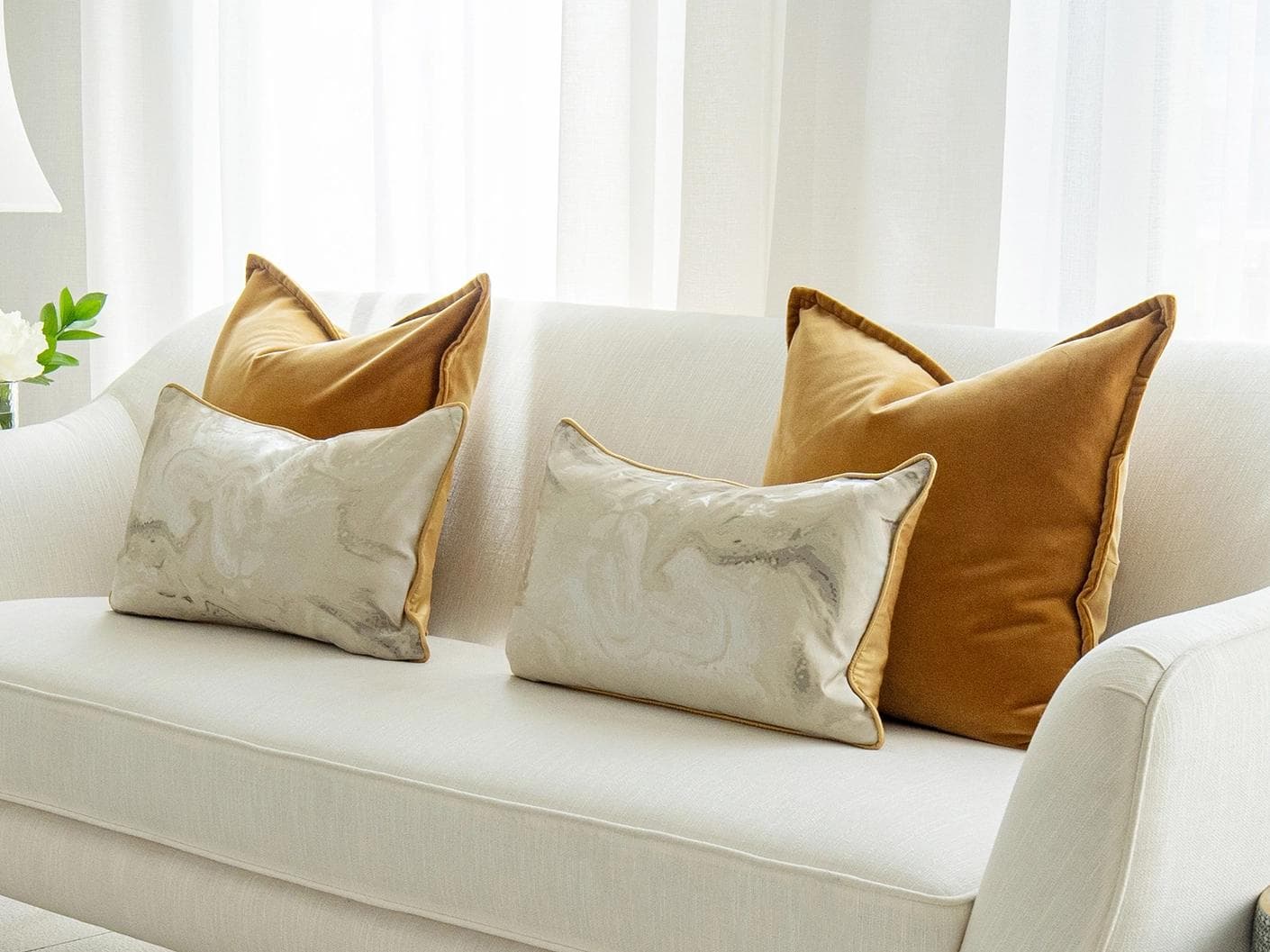 Johan Bundle cushion in orange, silver and yellow, shown in a lifestyle right view as image 2