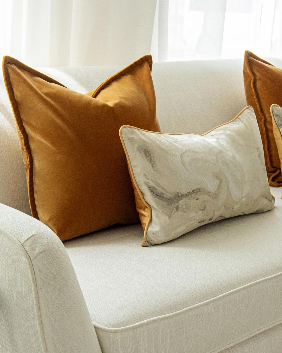 Johan Bundle cushion in orange, silver and yellow, shown in a product left view as image 6