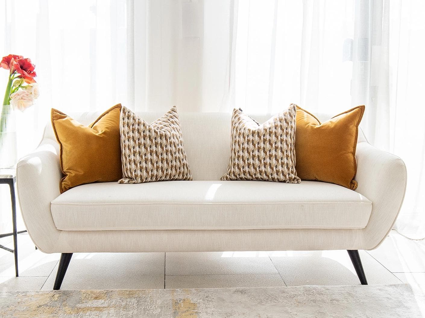 Phoebe Bundle cushion in orange, shown in a lifestyle front view as image 4