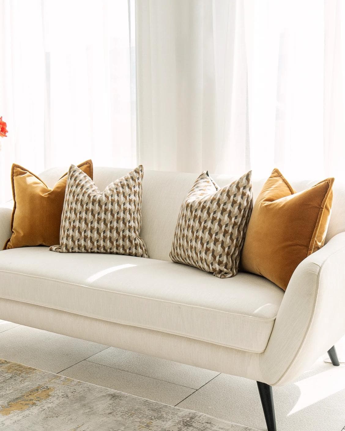 Phoebe Bundle cushion in orange, shown in a lifestyle right view as image 2