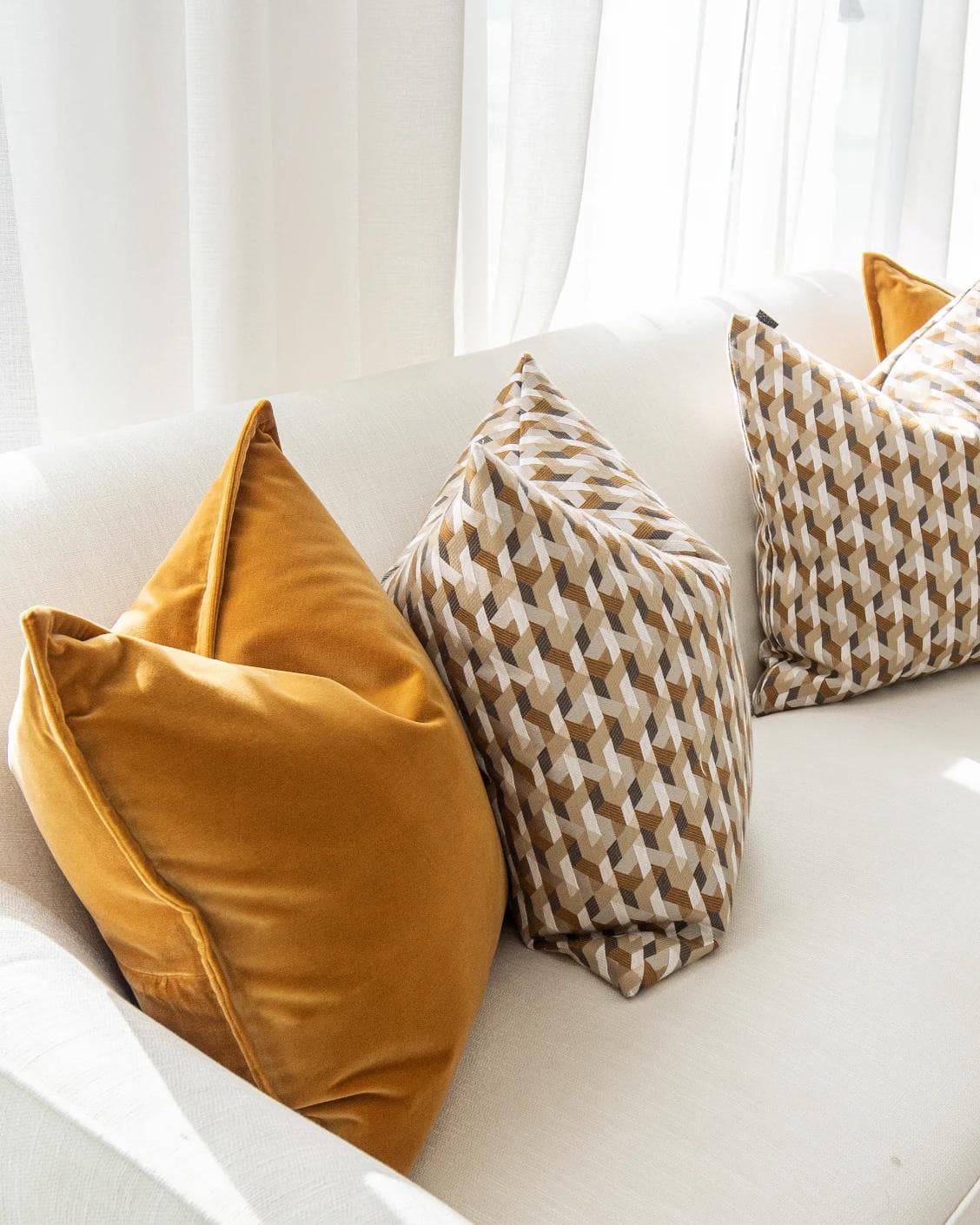 Phoebe Bundle cushion in orange, shown in a product left view as image 6