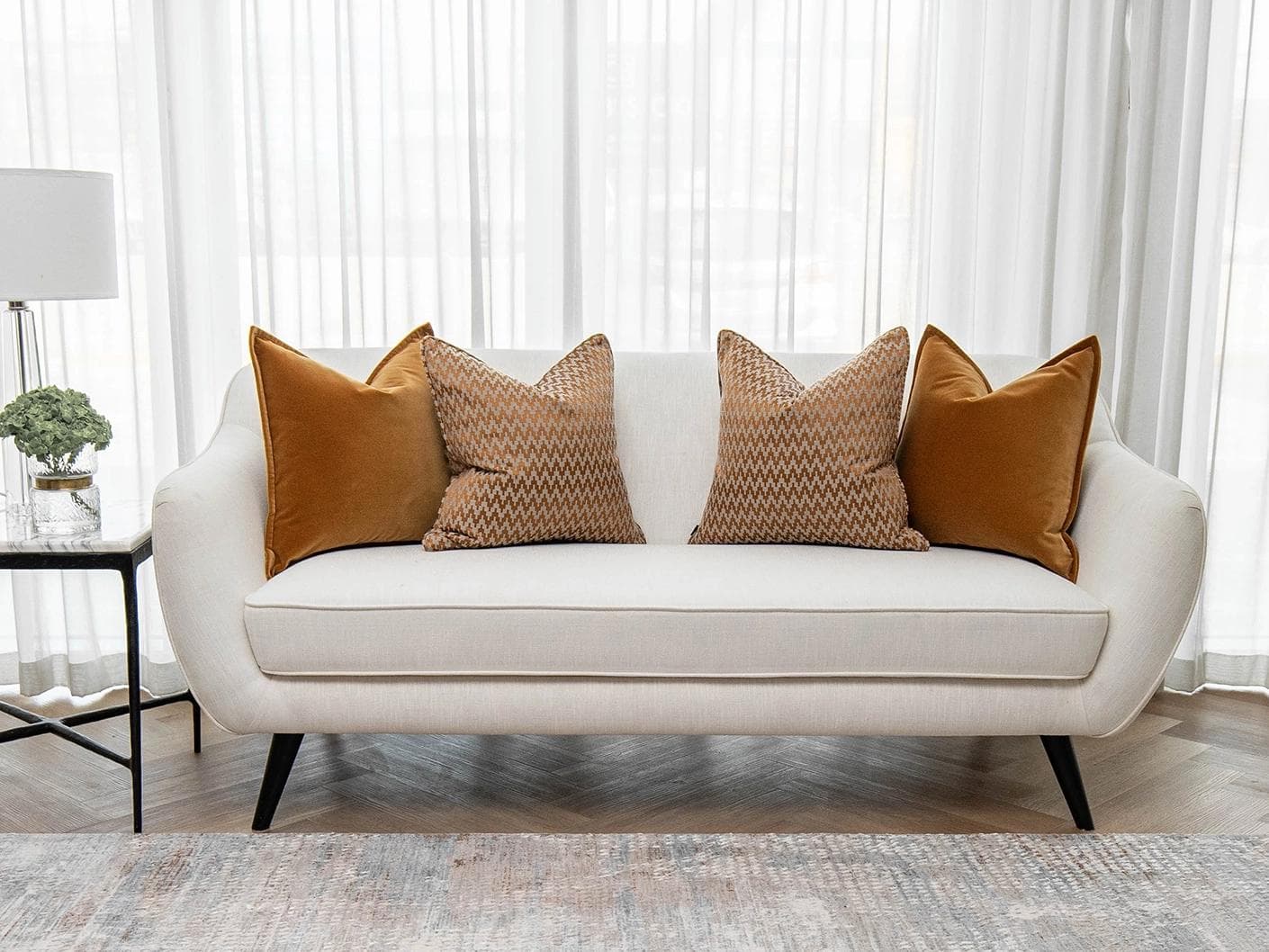 Cleopatra Bundle cushion in orange, shown in a lifestyle front view as image 4