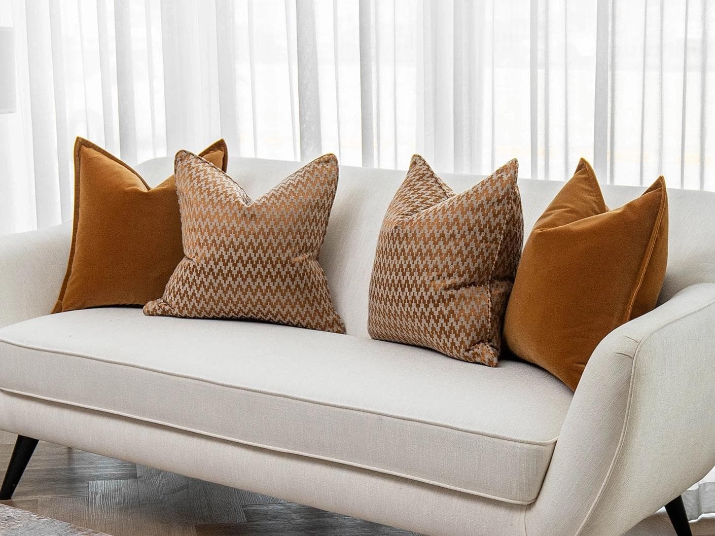 Cleopatra Bundle cushion in orange, shown in a lifestyle right view as image 2