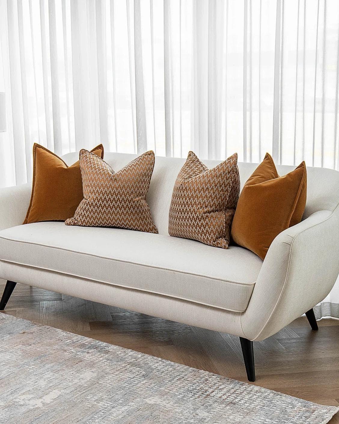Cleopatra Bundle cushion in orange, shown in a lifestyle right view as image 2