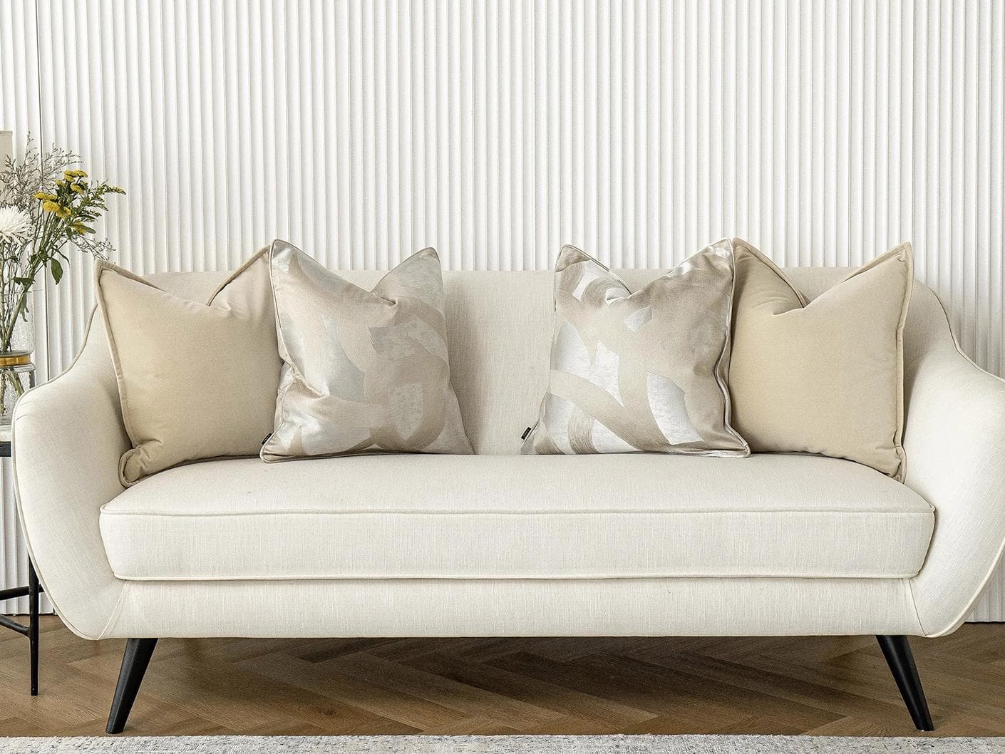 Bethyna Bundle cushion in beige and silver, shown in a lifestyle front view as image 4