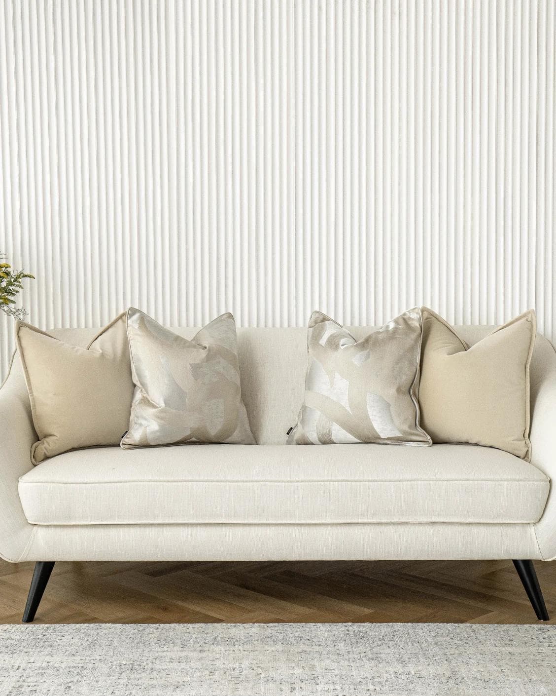 Bethyna Bundle cushion in beige and silver, shown in a lifestyle front view as image 4