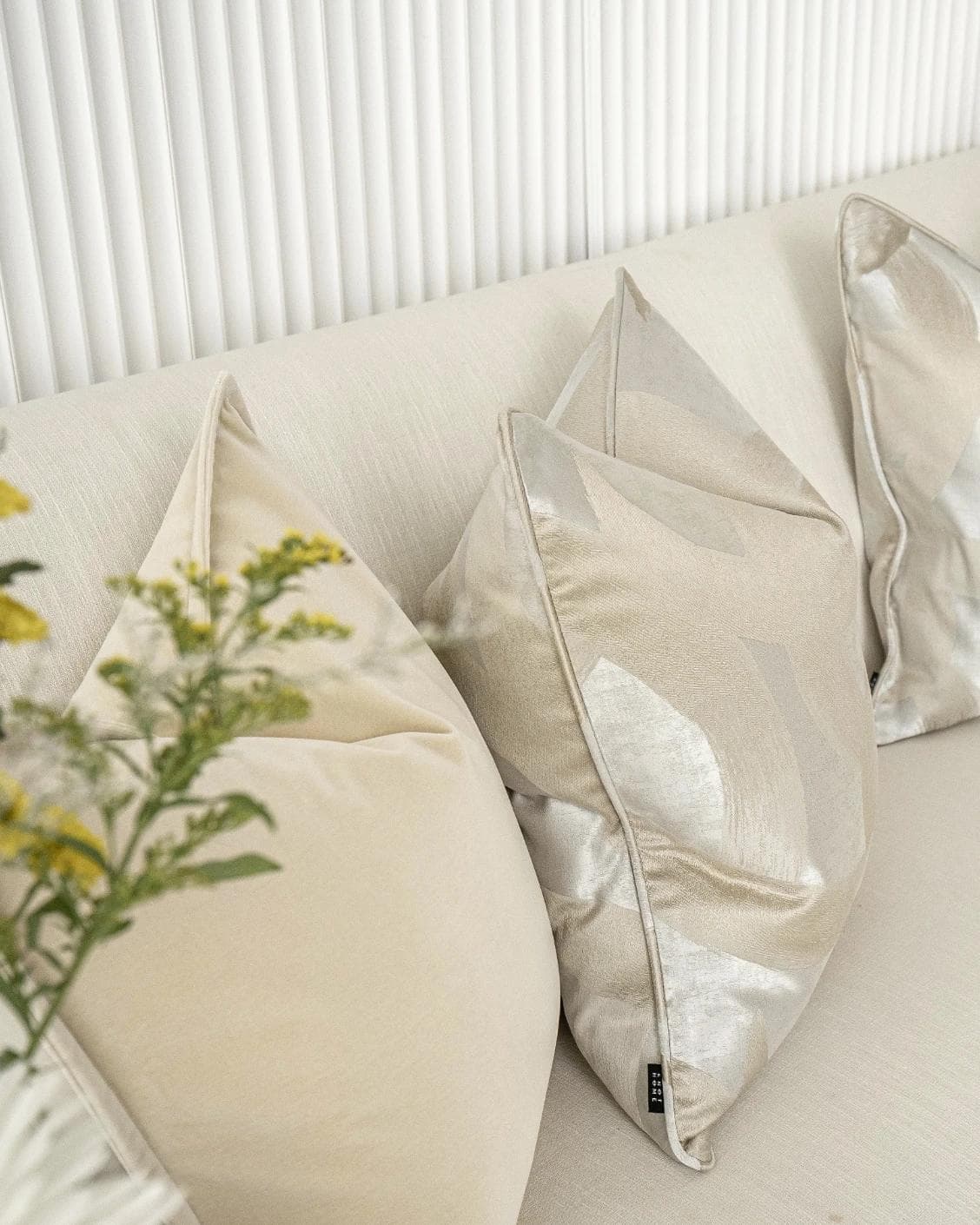 Bethyna Bundle cushion in beige and silver, shown in a lifestyle left view as image 5
