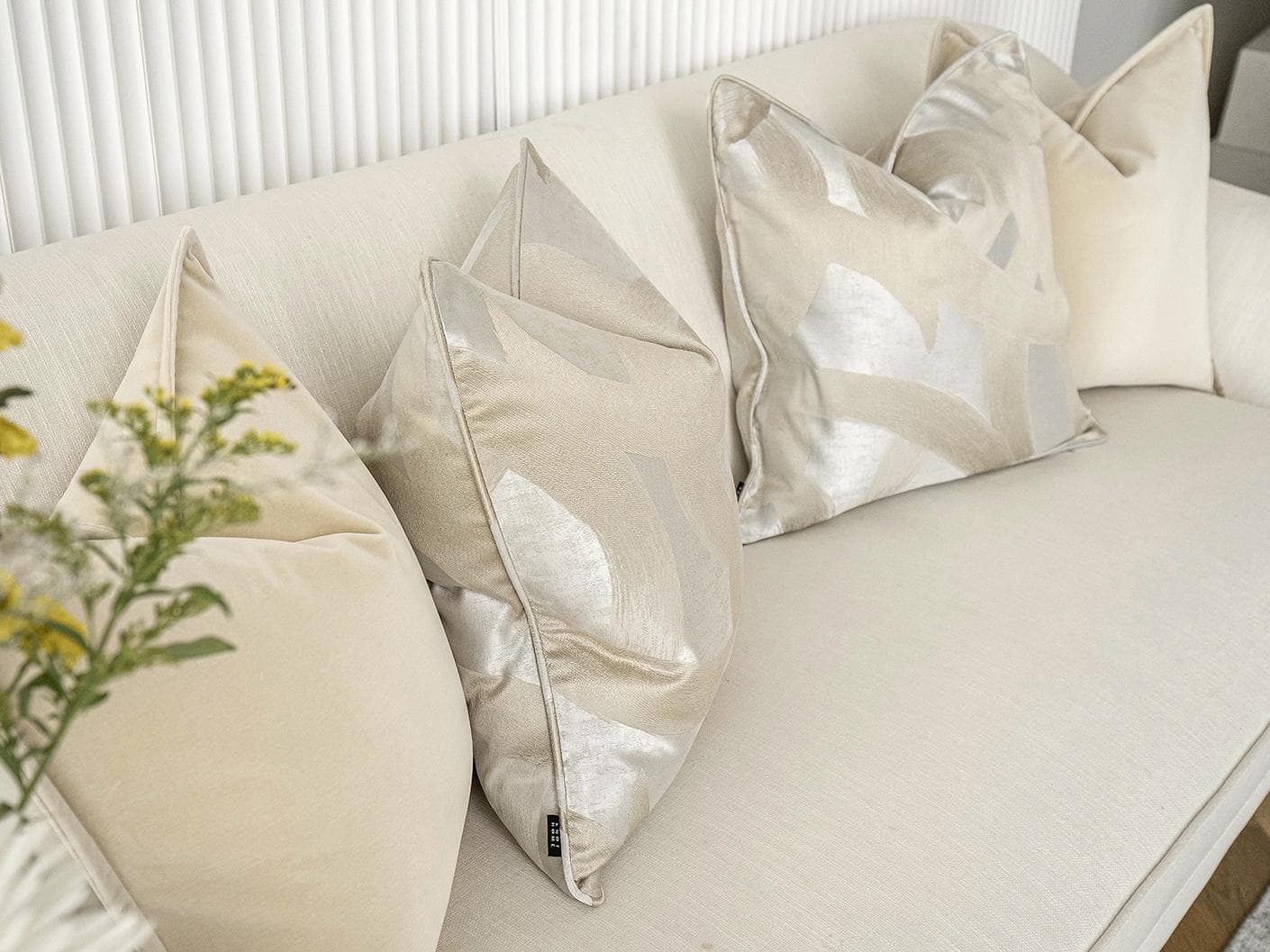 Bethyna Bundle cushion in beige and silver, shown in a lifestyle left view as image 5