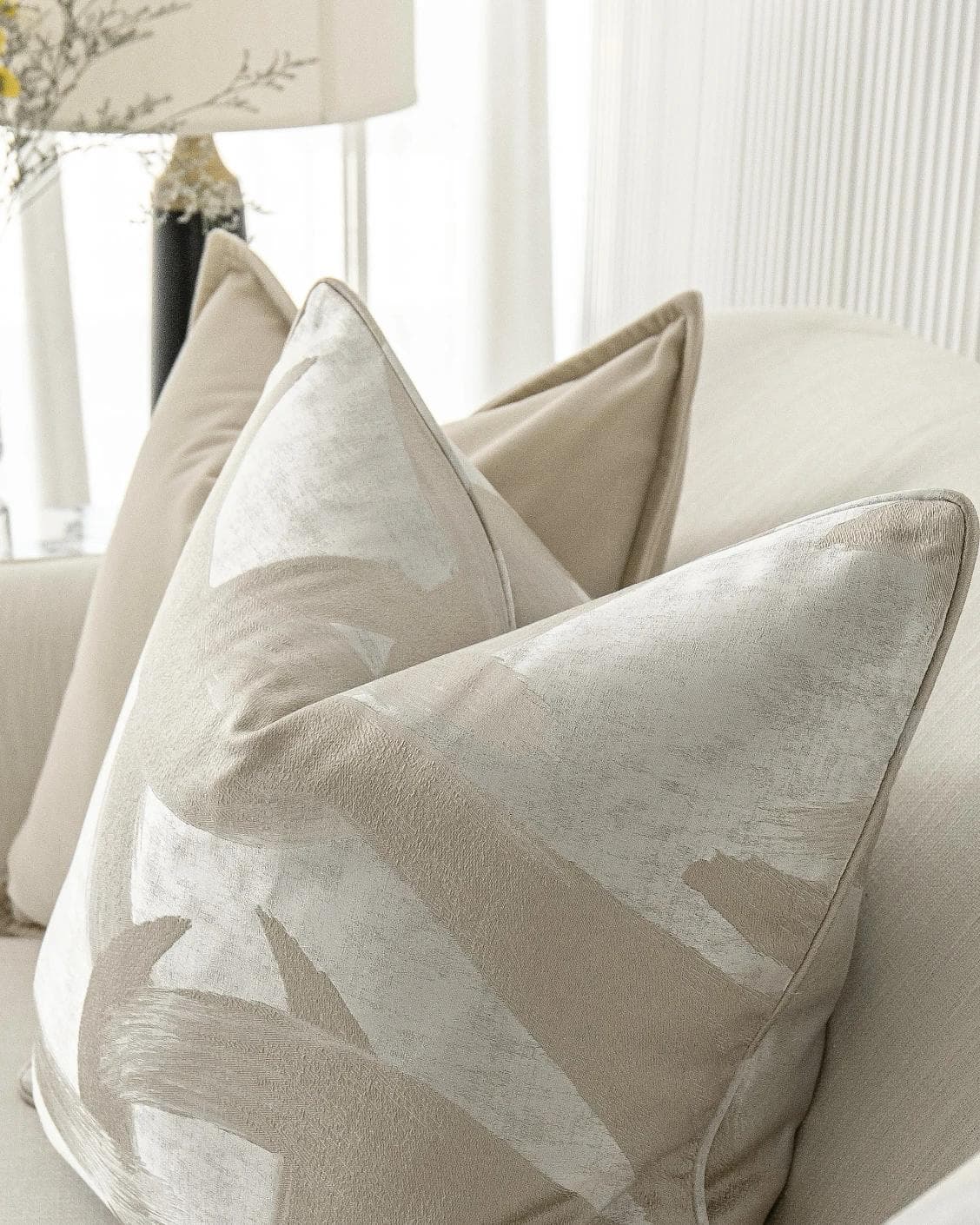 Bethyna Bundle cushion in beige and silver, shown in a lifestyle right view as image 6
