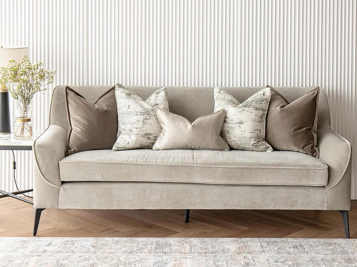 Timmy Bundle cushion in gold, brown, beige, grey and white, shown in a lifestyle front view as image 4