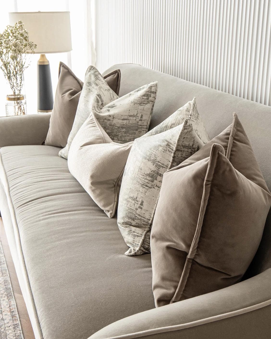 Timmy Bundle cushion in gold, brown, beige, grey and white, shown in a lifestyle right view as image 6
