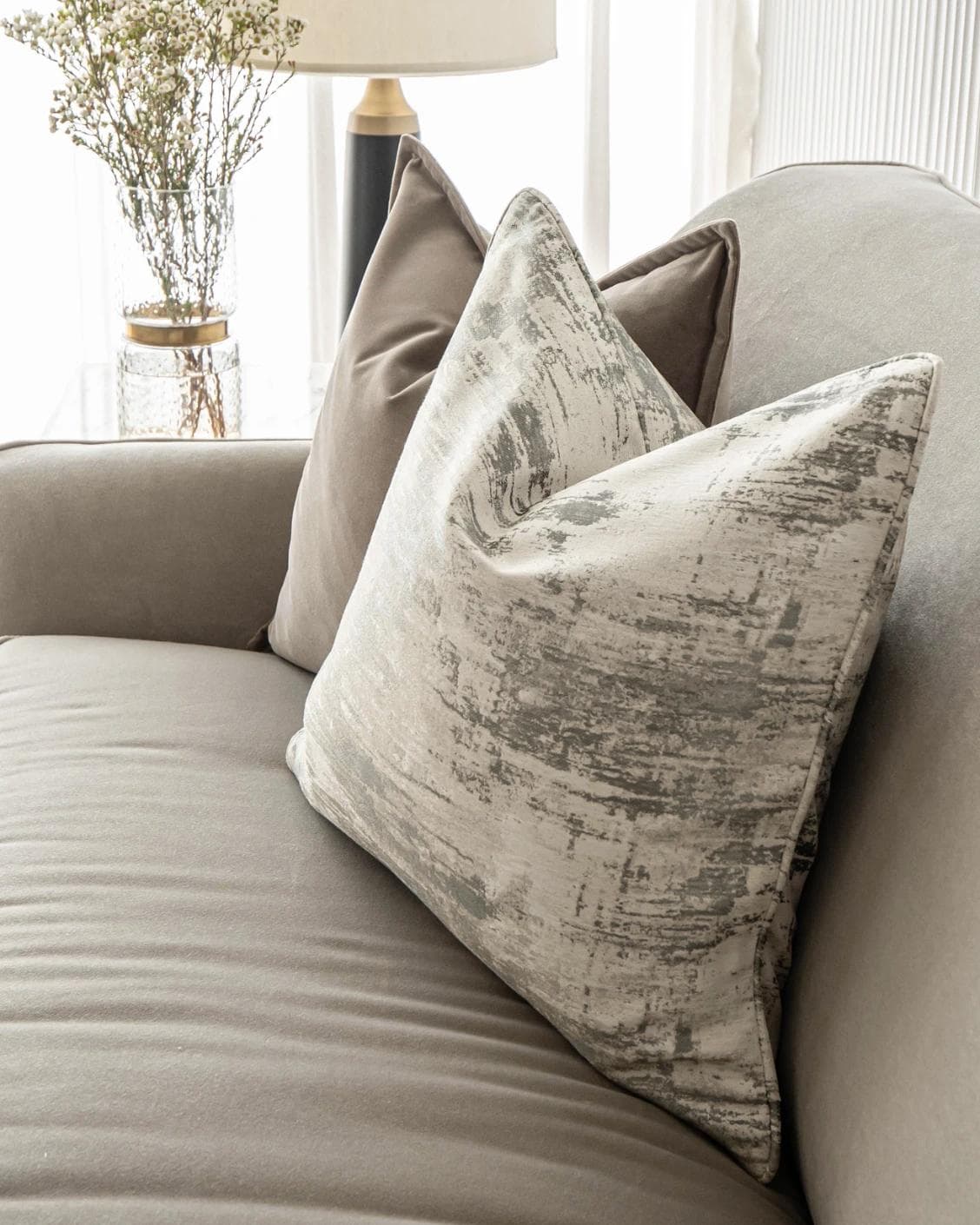 Timmy Bundle cushion in gold, brown, beige, grey and white, shown in a lifestyle right view as image 5