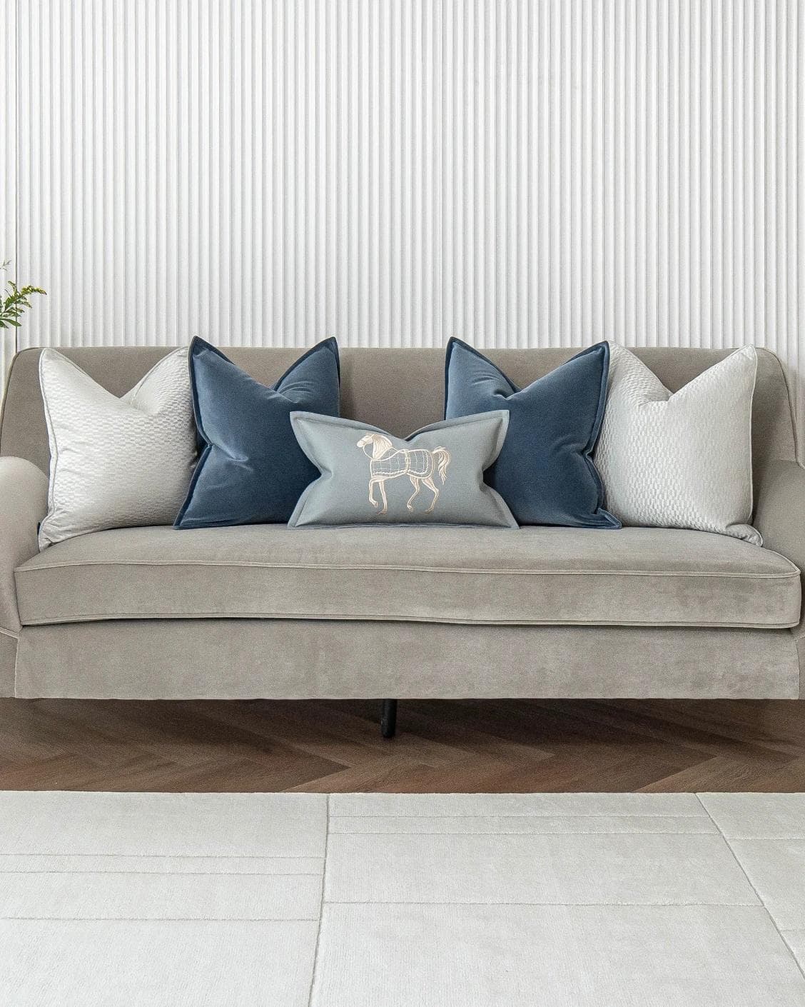 Kristal Bundle cushion in blue, silver and white, shown in a lifestyle front view as image 4