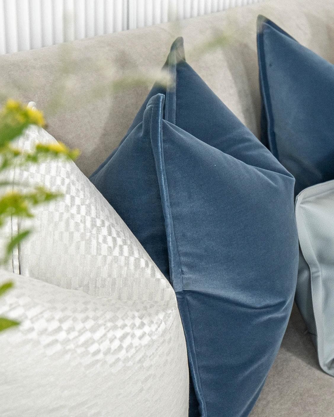 Kristal Bundle cushion in blue, silver and white, shown in a lifestyle left view as image 6