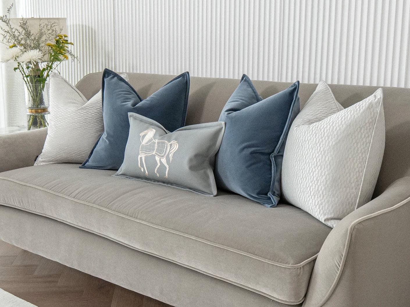 Kristal Bundle cushion in blue, silver and white, shown in a lifestyle right view as image 2