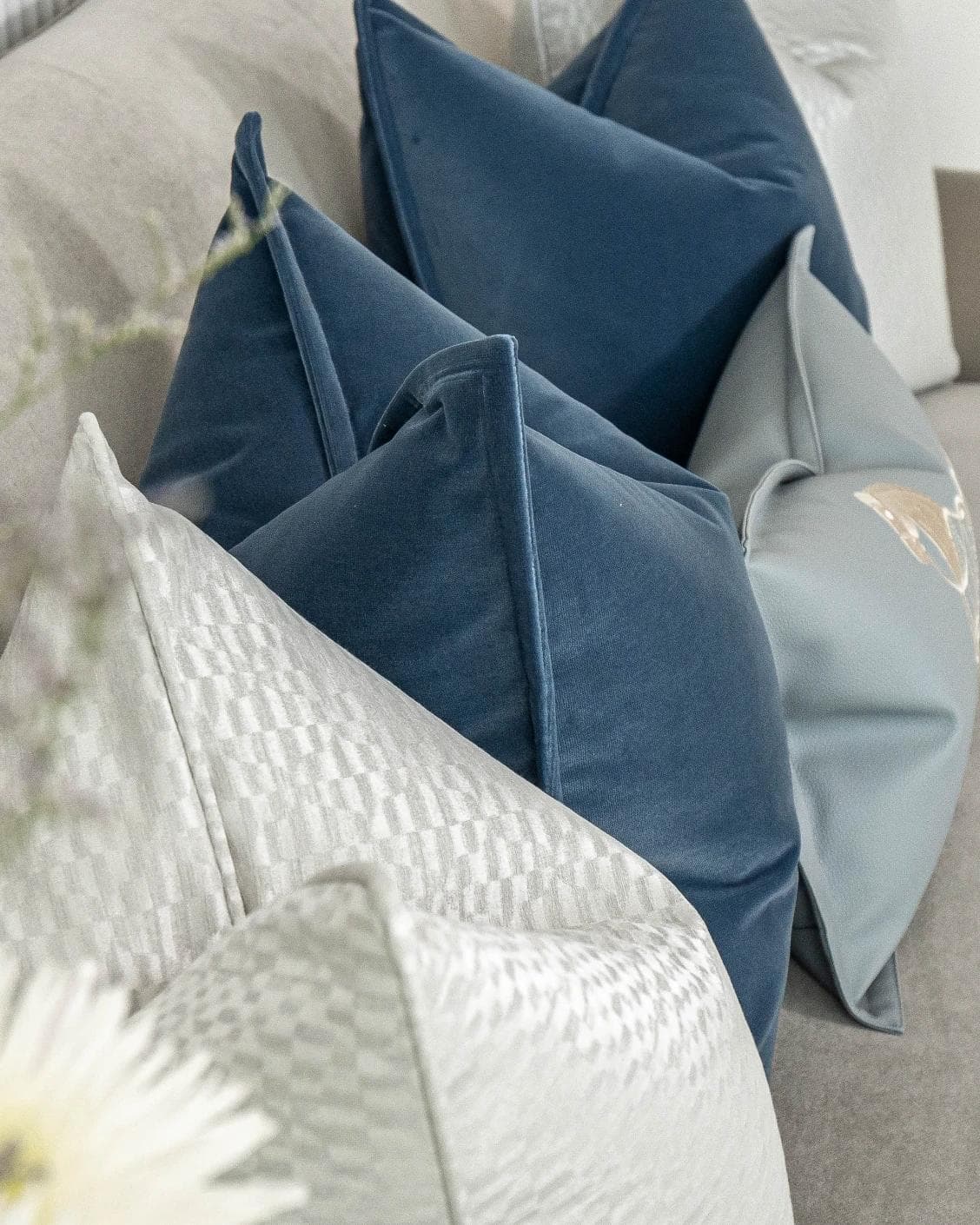 Kristal Bundle cushion in blue, silver and white, shown in a lifestyle top view as image 9