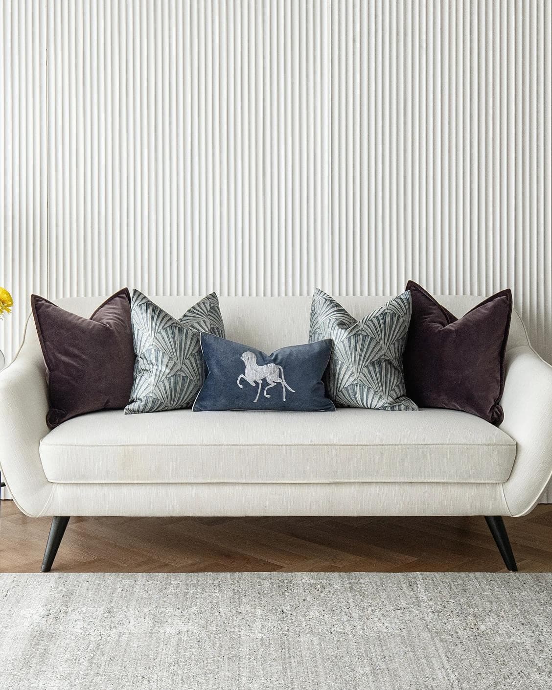 Fiavola Bundle cushion in purple, blue and silver, shown in a lifestyle front view as image 4