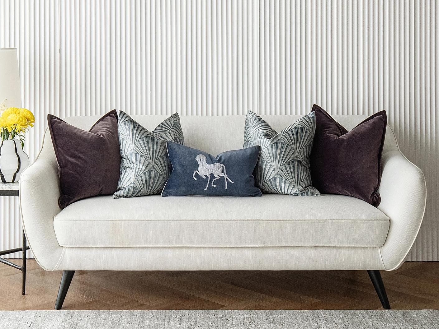 Fiavola Bundle cushion in purple, blue and silver, shown in a lifestyle front view as image 4
