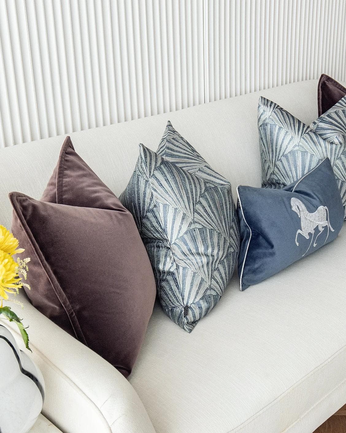 Fiavola Bundle cushion in purple, blue and silver, shown in a lifestyle left view as image 5