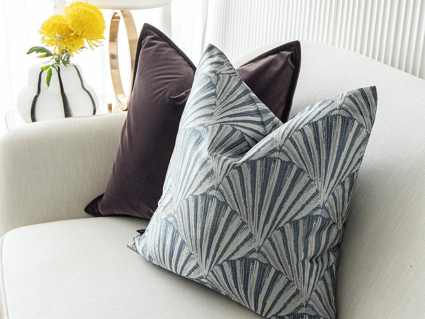 Fiavola Bundle cushion in purple, blue and silver, shown in a lifestyle right view as image 6