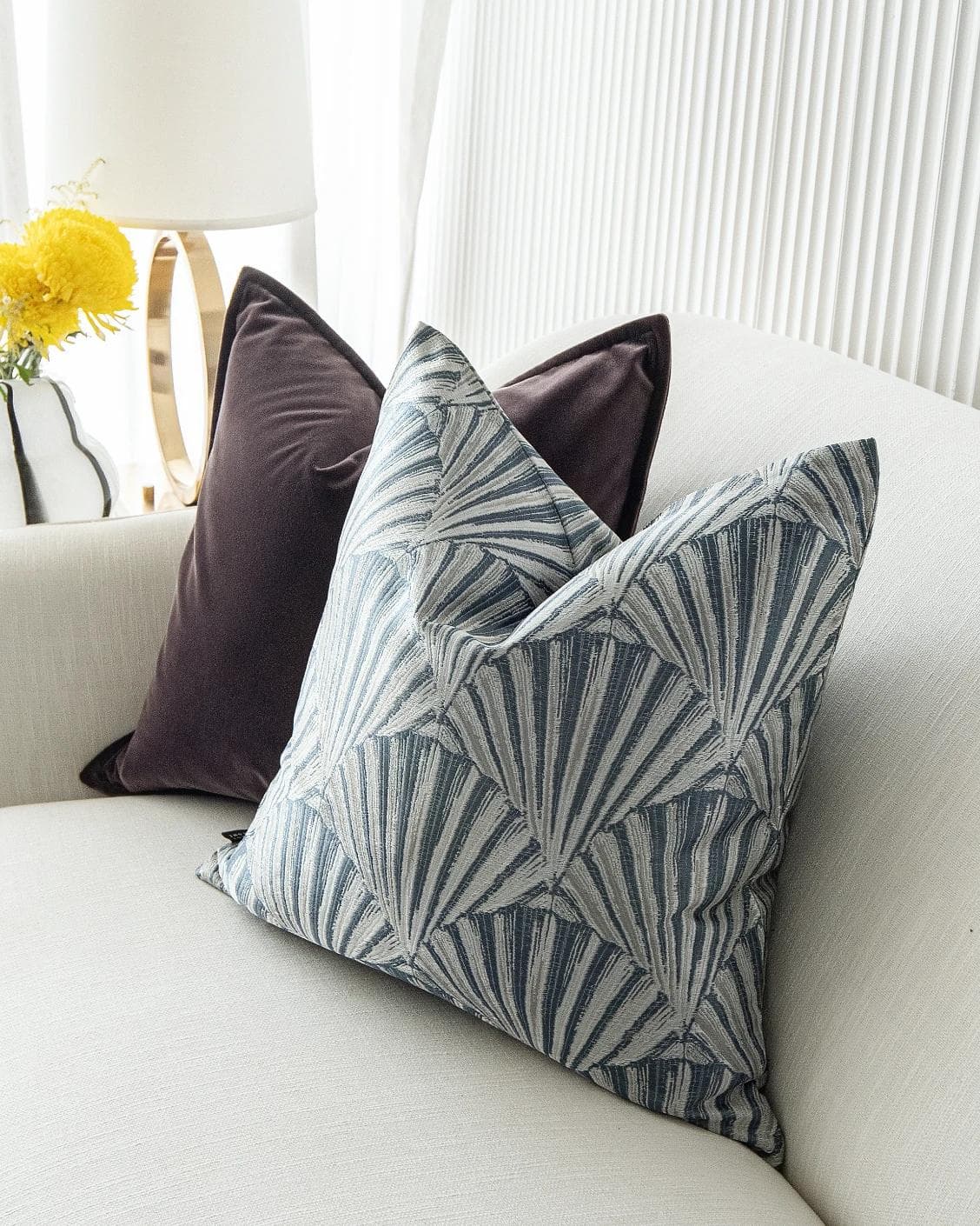 Fiavola Bundle cushion in purple, blue and silver, shown in a lifestyle right view as image 6