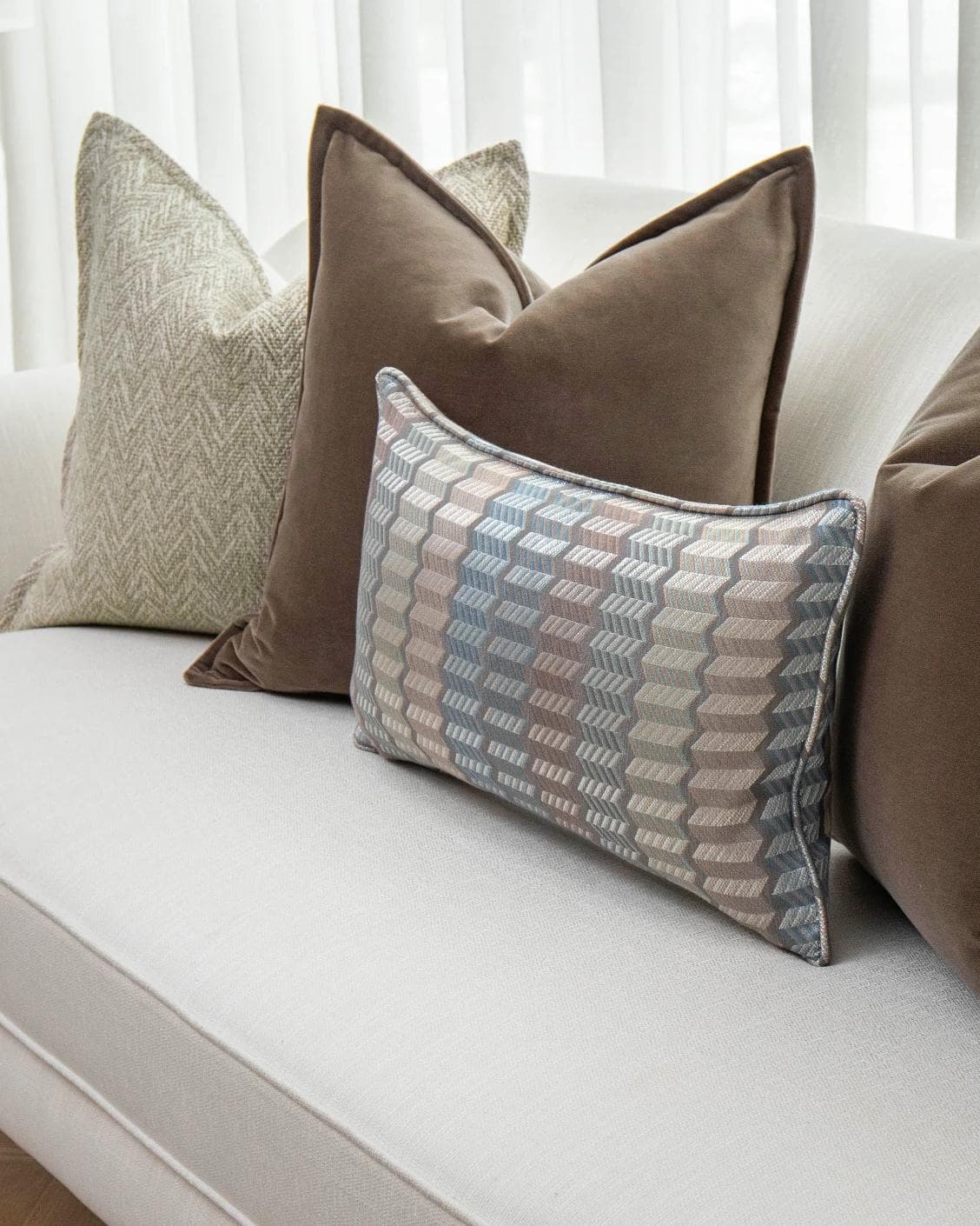 Jovie Bundle cushion in silver, blue, brown and beige, shown in a product right view as image 5