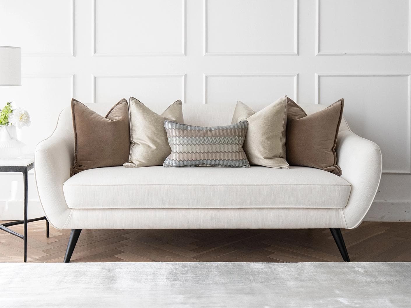 James Bundle cushion in silver, blue, brown and beige, shown in a lifestyle front view as image 4