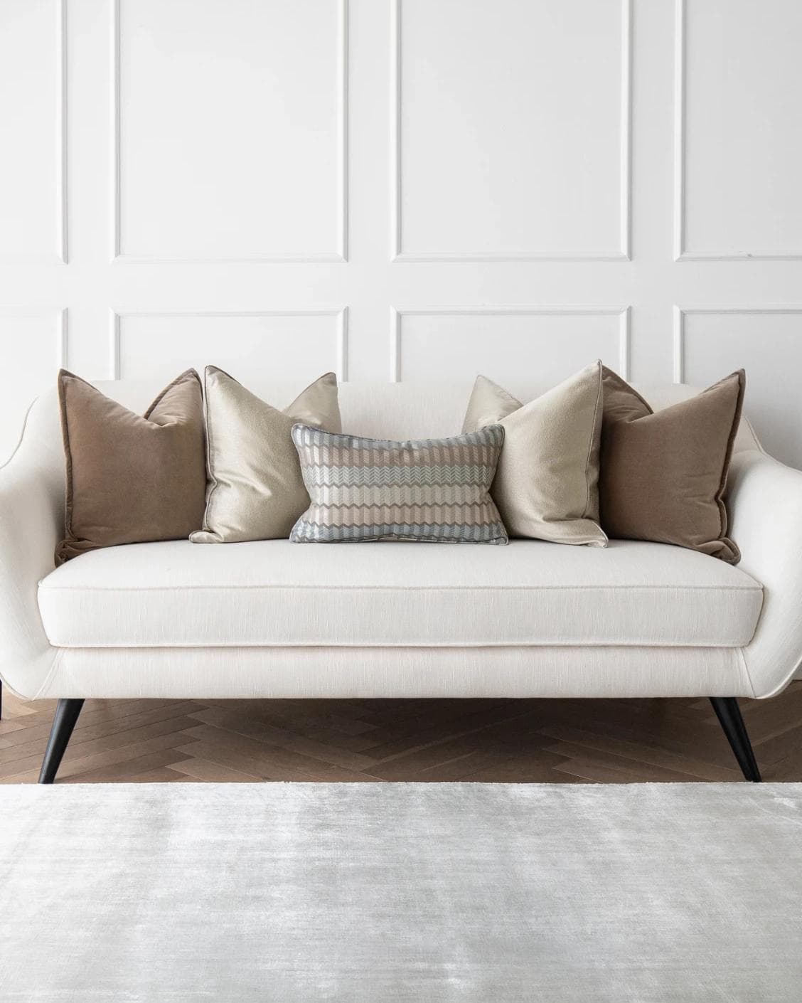 James Bundle cushion in silver, blue, brown and beige, shown in a lifestyle front view as image 4