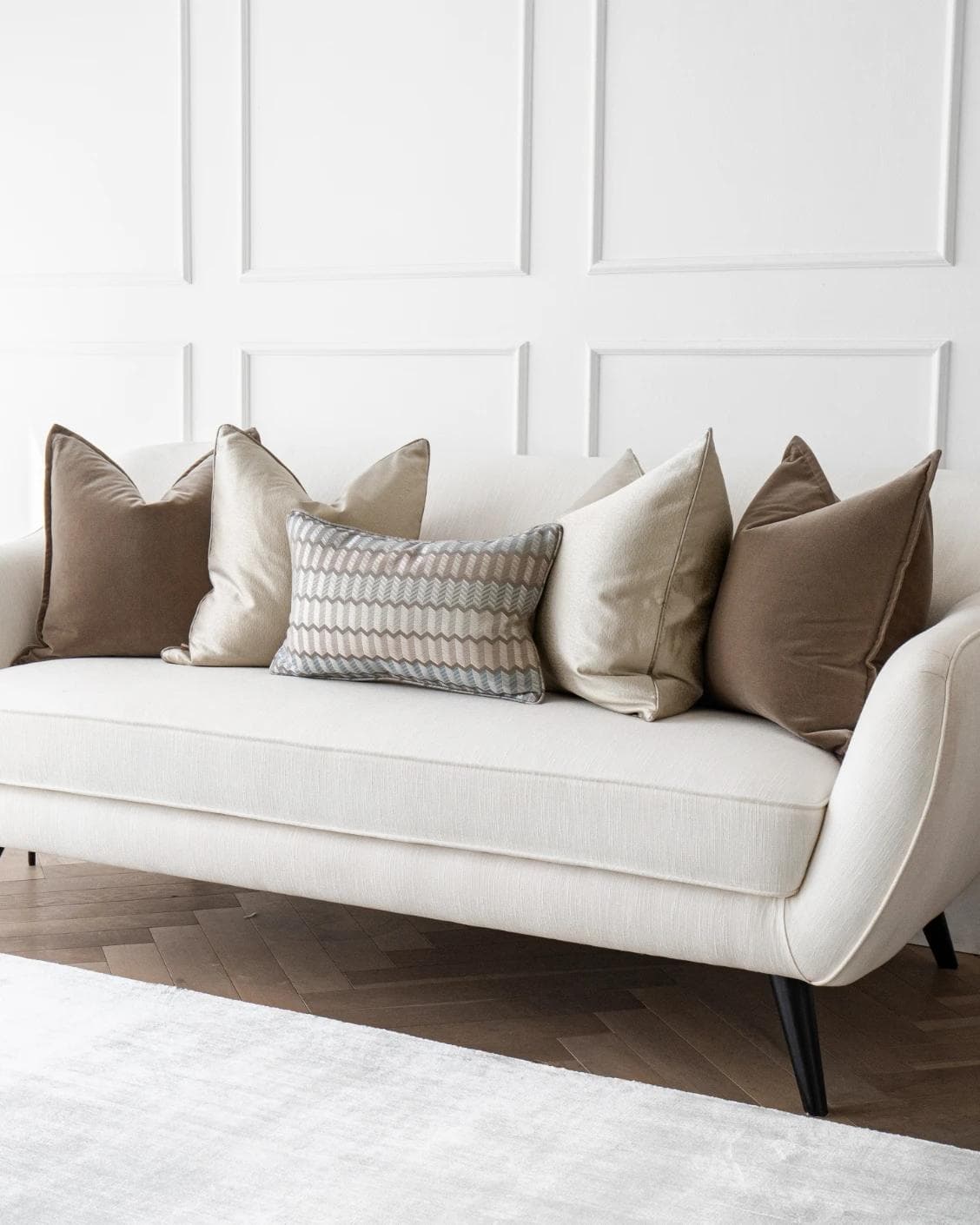 James Bundle cushion in silver, blue, brown and beige, shown in a lifestyle right view as image 2