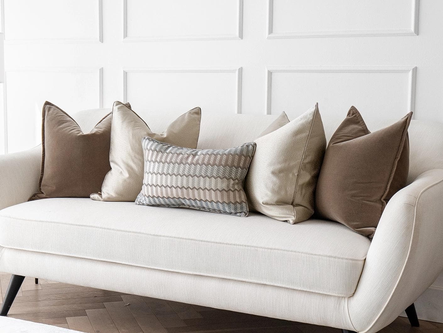 James Bundle cushion in silver, blue, brown and beige, shown in a lifestyle right view as image 2