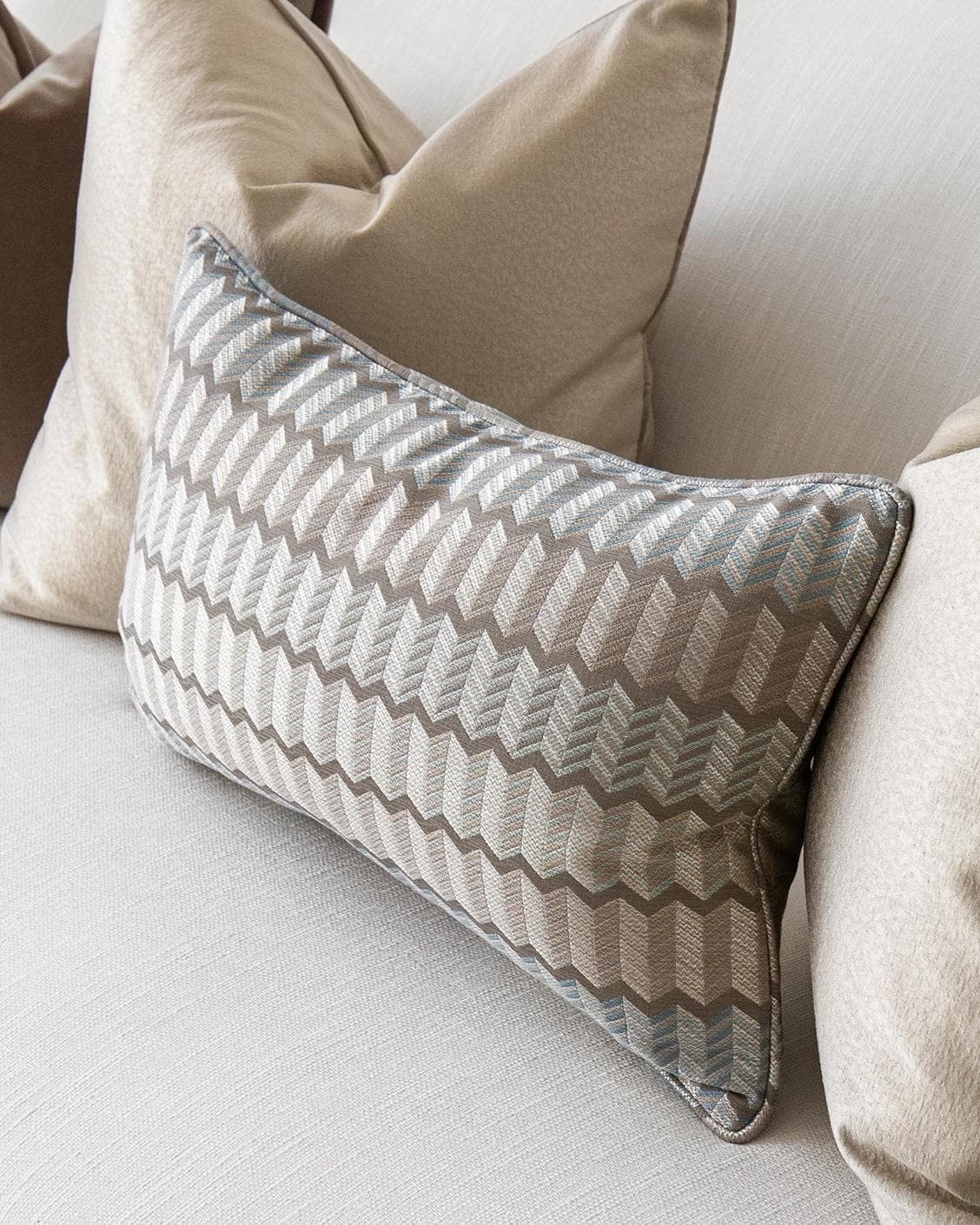James Bundle cushion in silver, blue, brown and beige, shown in a product right view as image 5