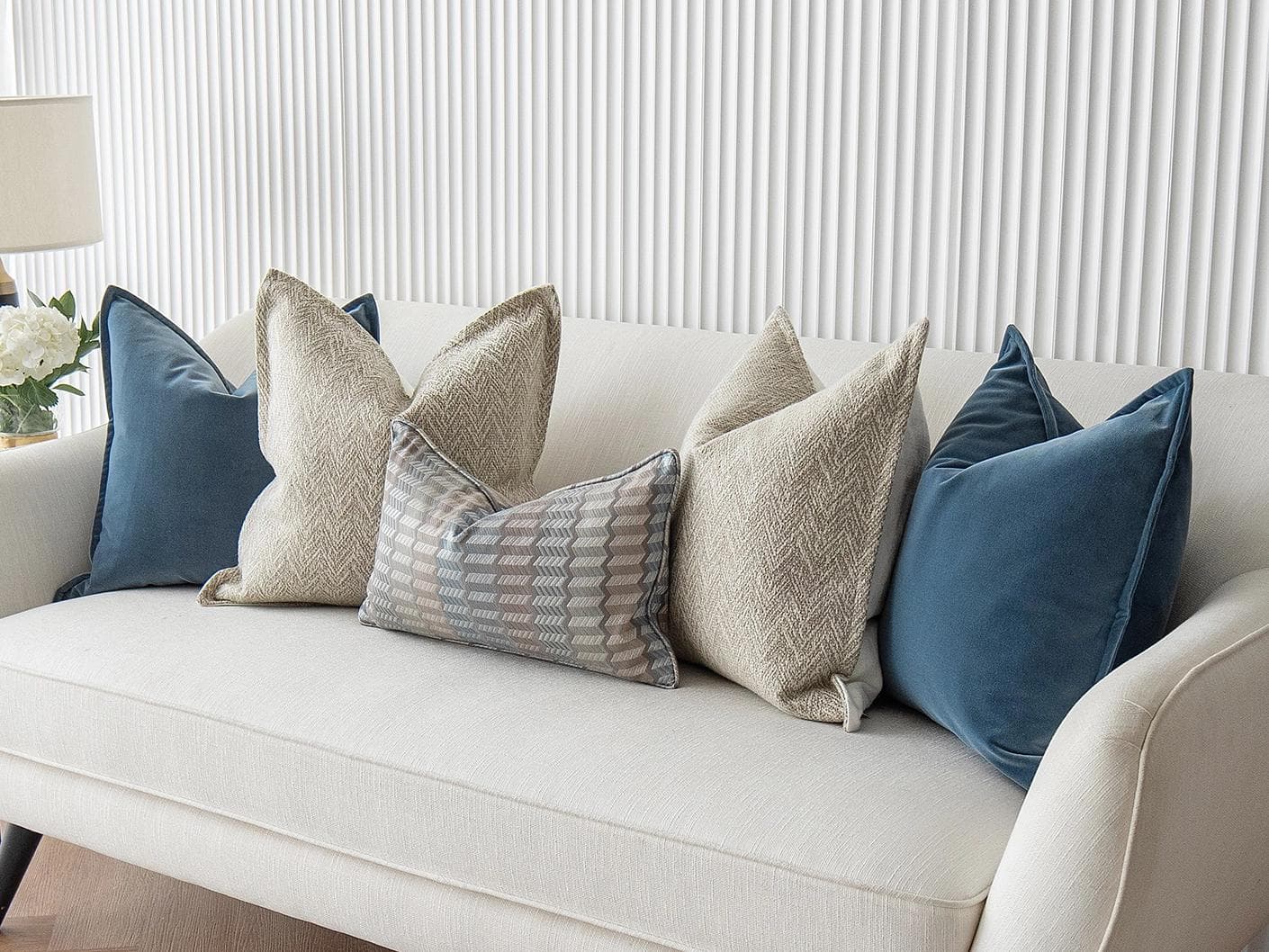 Stephan Bundle cushion in silver, blue and beige, shown in a lifestyle right view as image 4