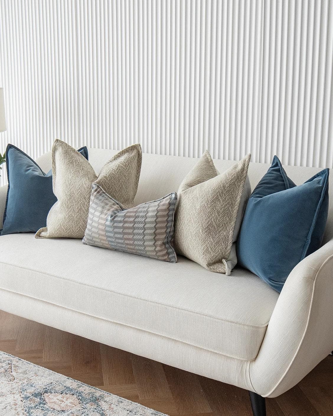Stephan Bundle cushion in silver, blue and beige, shown in a lifestyle right view as image 4